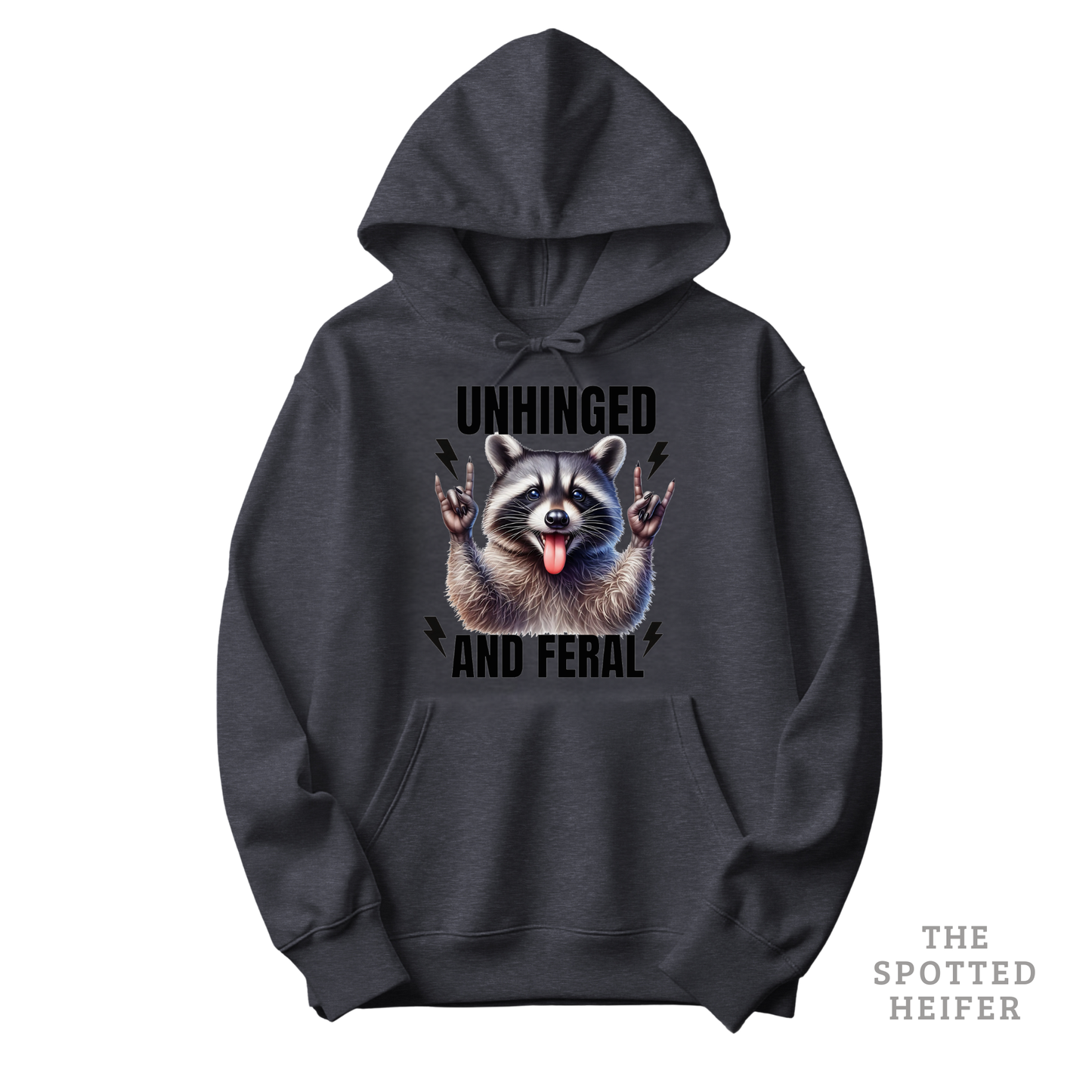Dark heather Gildan 18500 hoodie featuring “Unhinged and Feral” text with a mischievous raccoon graphic on the front – funny western hoodie by The Spotted Heifer.