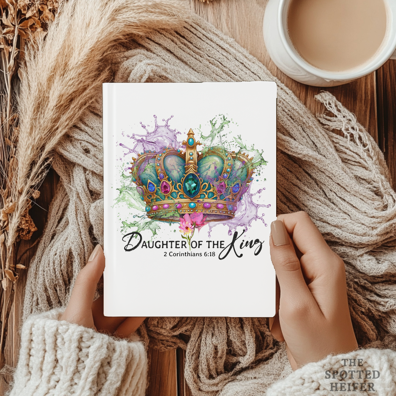 Woman holding Daughter of the King 2 Corinthians 6:18 faith journal with cozy blanket and coffee – The Spotted Heifer